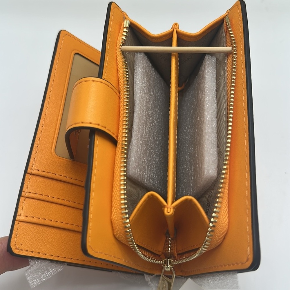 Michael Kors Jet Set Travel Medium Printed Signature Logo Bi-Fold 
Pop Orange - Picture 13 of 14